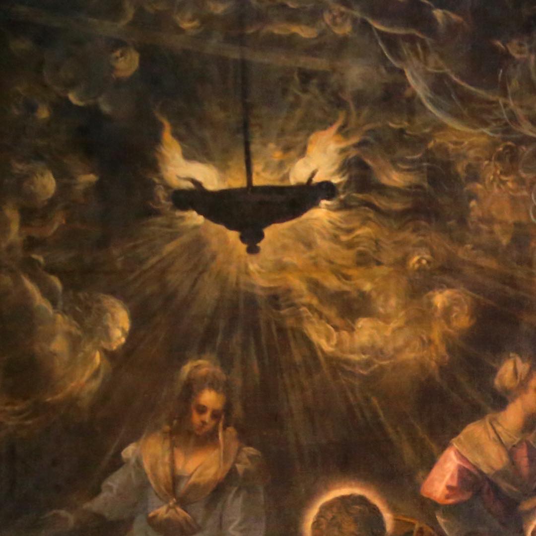 A hanging oil lamp, its flame throwing light across the ceiling, the smoke resolving into angels.